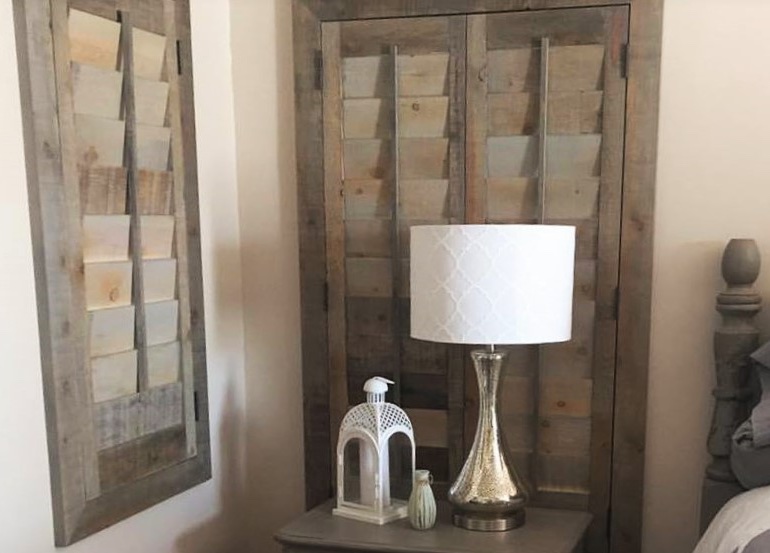 Jacksonville bedroom with repurposed wood shutters.